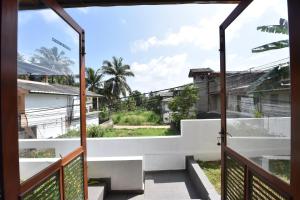 a view from the balcony of a house at Villa Serein - Garden Suite in Galle