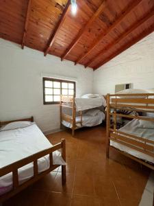 Ένα ή περισσότερα κρεβάτια σε δωμάτιο στο Casa quinta en Paso de la Patria Corrientes