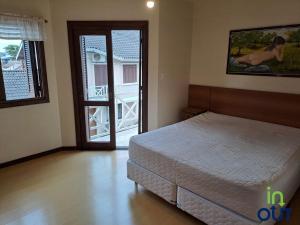 Postel nebo postele na pokoji v ubytování Sobrado em Canela