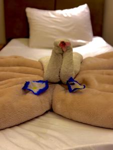 Ένα ή περισσότερα κρεβάτια σε δωμάτιο στο MaKanii Pyramids IINN +51 φωτογραφίες