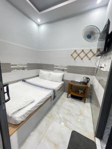 Ένα ή περισσότερα κρεβάτια σε δωμάτιο στο Ong 5 Homestay Can Tho