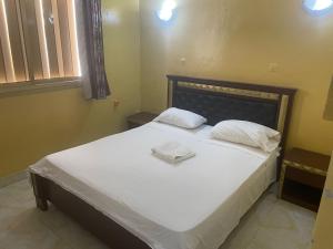 Postel nebo postele na pokoji v ubytování Hotel Ali Sabieh