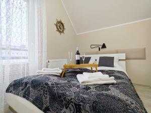 Postel nebo postele na pokoji v ubytování Morska Przystań e-apart pl