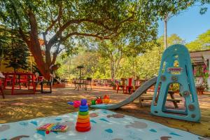 a playground with a slide in a park at Casa Do Leão - Heritage Boutique Stay in Nerul