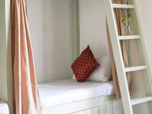 a room with a shelf with a pillow on it at Dorm Room in Boutique Wellness Hotel in Mirissa