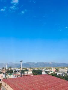 a view of a city from the roof of a building at The Nest spacious and homely flat in Haldwani in Haldwāni