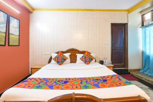 Postel nebo postele na pokoji v ubytování FabHotel Elegant Stay + 18 fotografií