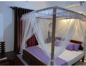 Ένα ή περισσότερα κρεβάτια σε δωμάτιο στο Moon View Homestay +8 φωτογραφίες