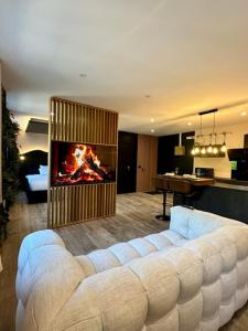 Posezení v ubytování La Suite Aimée - Espace relaxant avec balnéo