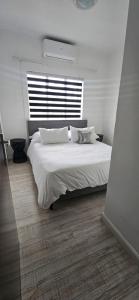 Ένα ή περισσότερα κρεβάτια σε δωμάτιο στο Motswana