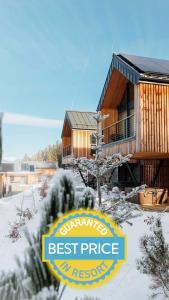 a cabin in the winter with snow on the ground at TRI VODY Demänovská Dolina in Liptovský Mikuláš
