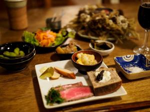 a table with a plate of food on a table at Lodge Jotenki in Kiso +12 photos