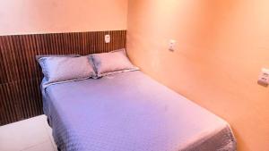 En eller flere senge i et værelse på Apartamento 2 quartos ótima localização em Belem