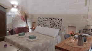 Postel nebo postele na pokoji v ubytování A Casa di Nonna Lina