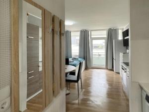 a room with a table and a dining room at Work & Stay in Neuss in Neuss