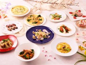 a group of plates of food on a table at Villa Fontaine Grand Tokyo Ariake in Tokyo
