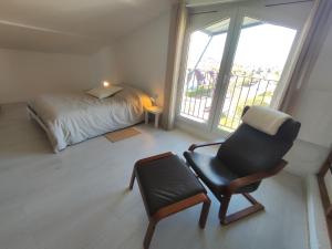 Postel nebo postele na pokoji v ubytování Duplex moderne, chaleureux au calme à Toison d'or