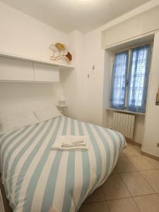 Ένα ή περισσότερα κρεβάτια σε δωμάτιο στο La casa di Tina a 20 metri dal mare