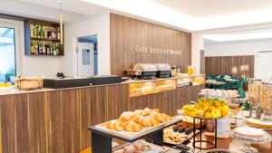 a buffet line with bread and fruit on display at Resort & Winery Bosco De Medici in Pompei