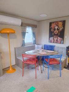 a living room with a table and four chairs at Seton Sands Holiday Village GULLANE 5 in Longniddry
