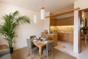 a kitchen and dining room with a table and chairs at Antella Residence in Bagno a Ripoli
