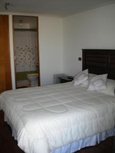 Säng eller sängar i ett rum på Barceló Suites Providencia I