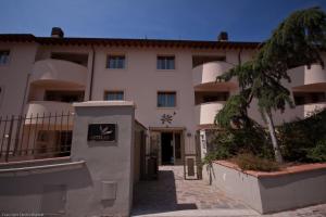 a building with a sign in front of it at Antella Residence in Bagno a Ripoli