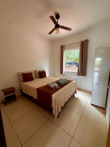 Ένα ή περισσότερα κρεβάτια σε δωμάτιο στο Village Villa Sossego