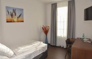 Postel nebo postele na pokoji v ubytování Vittoria Hotel-Restaurant