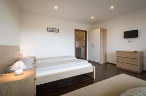 Postel nebo postele na pokoji v ubytování Apartments Horní Brána