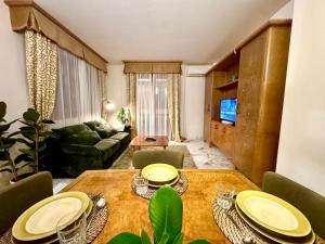 a living room with a table and a couch at Antella Residence in Bagno a Ripoli