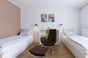 Ένα ή περισσότερα κρεβάτια σε δωμάτιο στο Candlewood Suites Fürth by IHG +128 φωτογραφίες