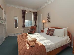 Postel nebo postele na pokoji v ubytování Auchentroig House