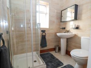 a bathroom with a shower and a toilet and a sink at The Lily Pad in Chester +24 photos