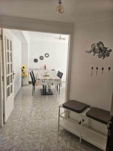 a dining room with a table and chairs at Pedrogão Soul & Sunset in Pedrógão +19 photos