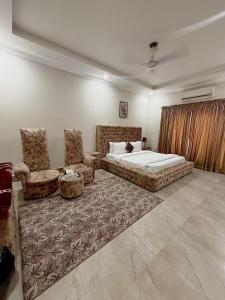 Ένα ή περισσότερα κρεβάτια σε δωμάτιο στο Paradise Guest House Islamabad +11 φωτογραφίες