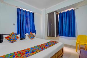 Giường trong phòng chung tại Hotel Naman