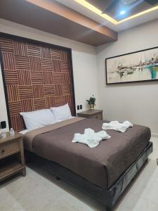 Postel nebo postele na pokoji v ubytování Socram GH