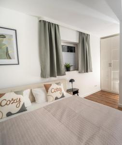 Postel nebo postele na pokoji v ubytování Cozy 9