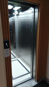 a glass door of a elevator in a building at Hotel Zaniah in Huancayo