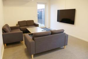TV a/nebo společenská místnost v ubytování Smart-Stay-Padborg