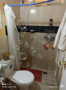 a bathroom with wine glasses on the wall at Apartamento Privado Luna Bella in Quetzaltenango