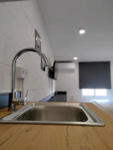 a stainless steel kitchen sink in a kitchen at Visitar La Campana in La Campana