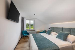 TV a/nebo společenská místnost v ubytování Hotel Rheingerbe