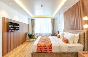 Postel nebo postele na pokoji v ubytování Hotel The Canvas International Near Delhi Airport + 3 fotografie