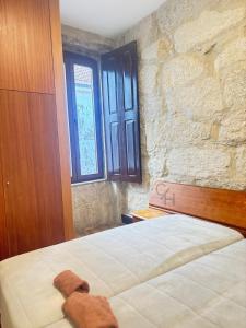 Ένα ή περισσότερα κρεβάτια σε δωμάτιο στο CIH - Constituição Invicta Home