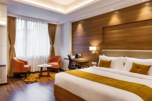 Ένα ή περισσότερα κρεβάτια σε δωμάτιο στο Hotel The Grand Helix Near Delhi Airport