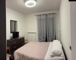 Ένα ή περισσότερα κρεβάτια σε δωμάτιο στο Casina di Lilli