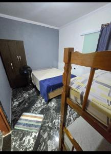 a bedroom with two bunk beds in it at Marea Home in Arraial do Cabo
