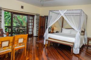 Postel nebo postele na pokoji v ubytování Safari Park Hotel